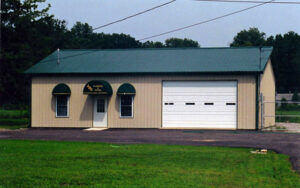 Beige post-frame office building with garage.