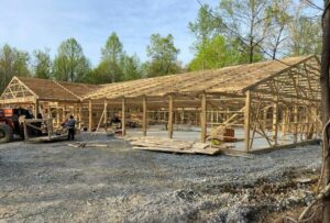 The framework of a post-frame garage under construction.