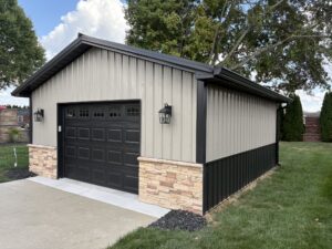 Side view post-frame construction garage with brick base